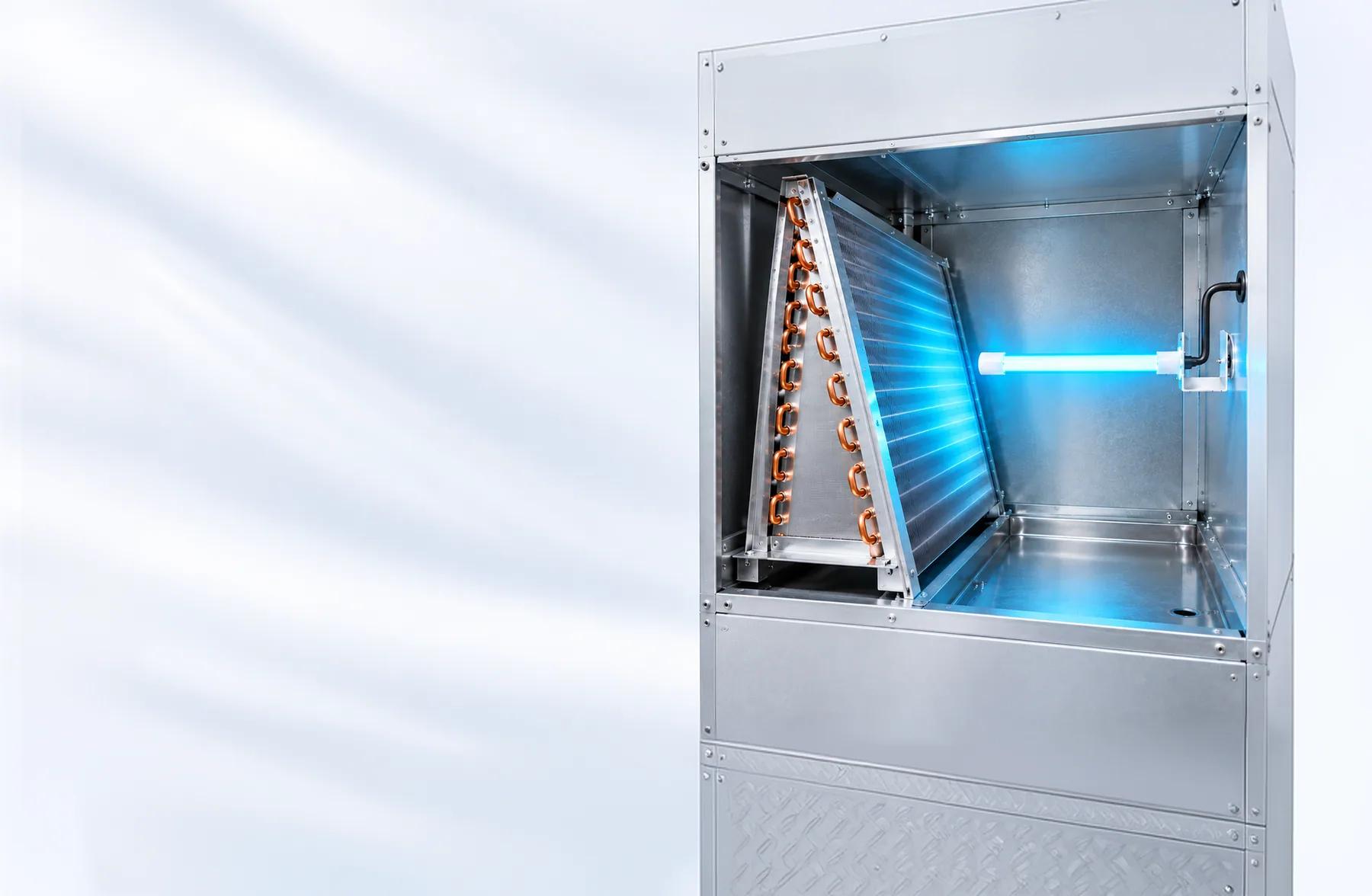 Cutaway of a home air handler with a UV-C lamp shining across the wet evaporator coil.