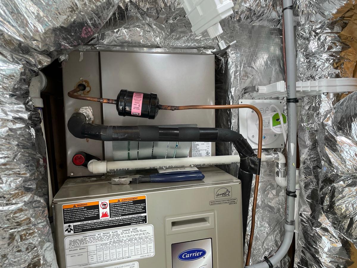 Carrier upflow furnace with A-coil on top showing UV lamp installation area