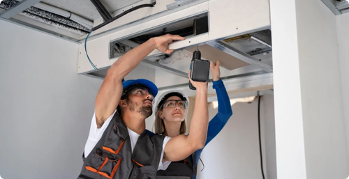 HVAC technicians installing BioShield UV system