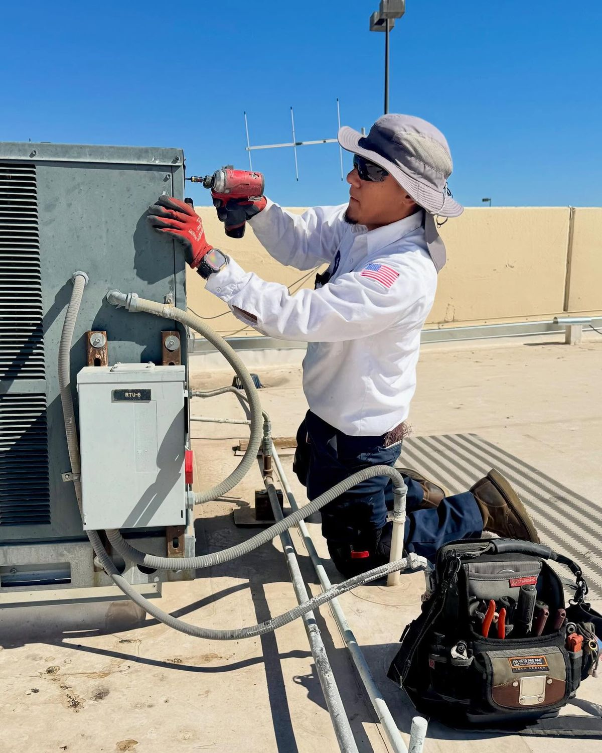 HVAC technician performing installation