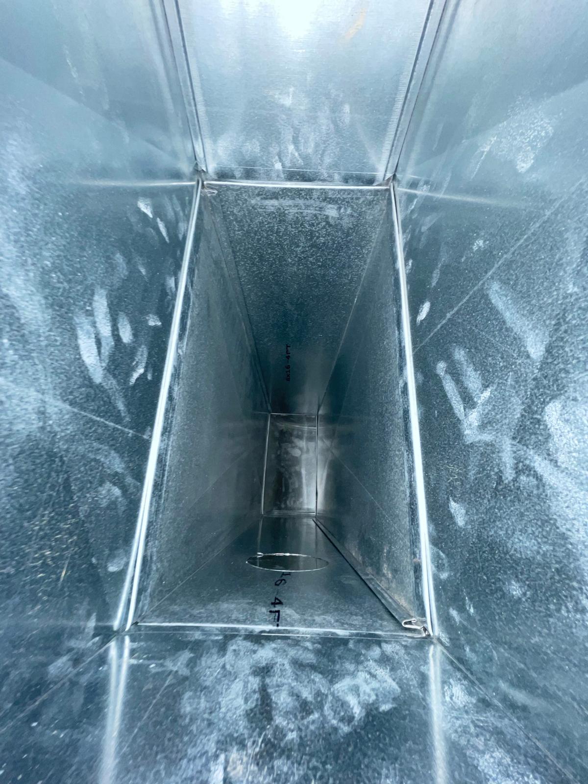 Inside supply side ductwork showing UV purifier location relative to coil