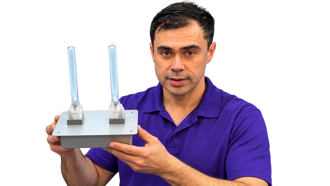 BioShieldUV presenter holding the Classic 36W twin-lamp unit.
