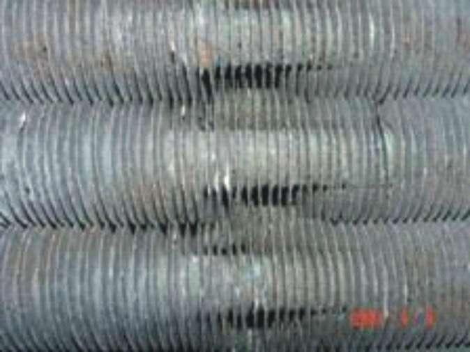 Same evaporator coil after 7 months of UV-C treatment — fins fully clean and visible